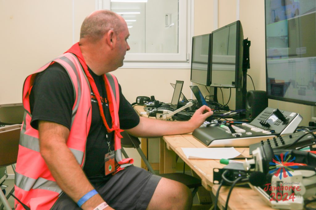 A member of the stage team, monitoring the action on computer screens