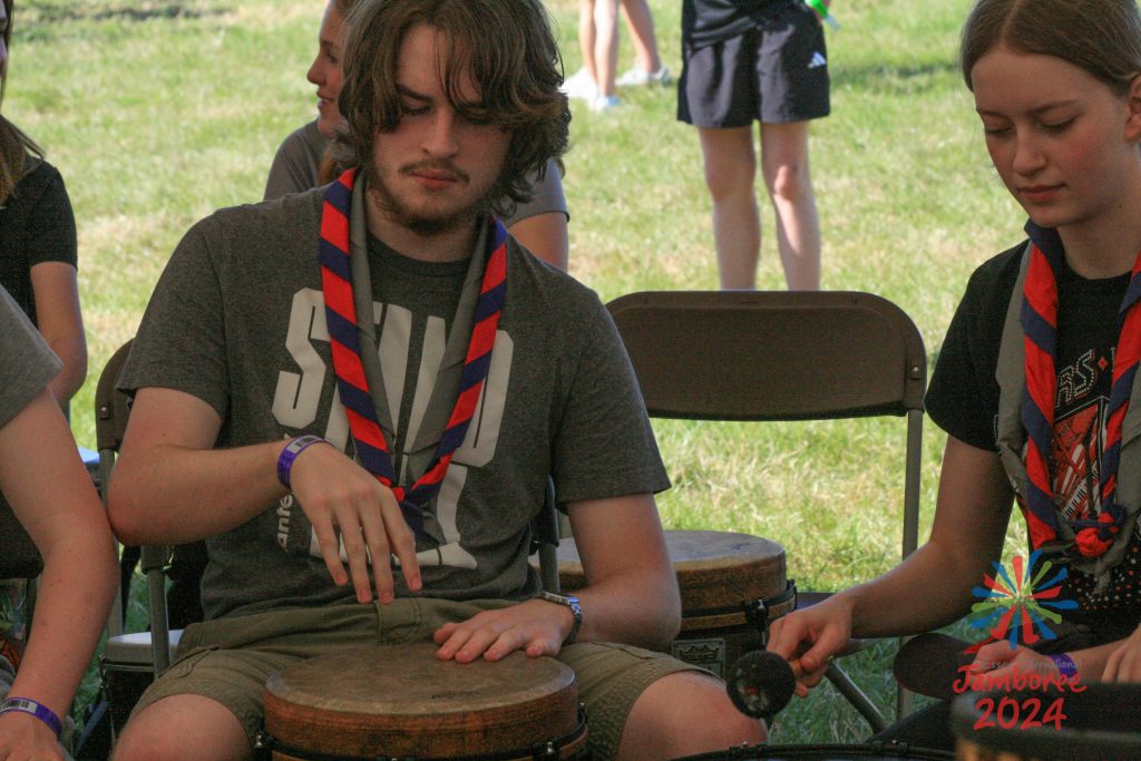 Scouts practising African drumming techniques