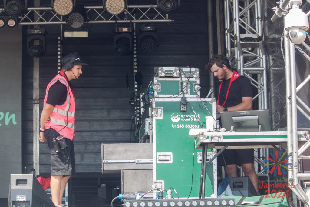 Two members of the stage team, working on the EIJ main stage