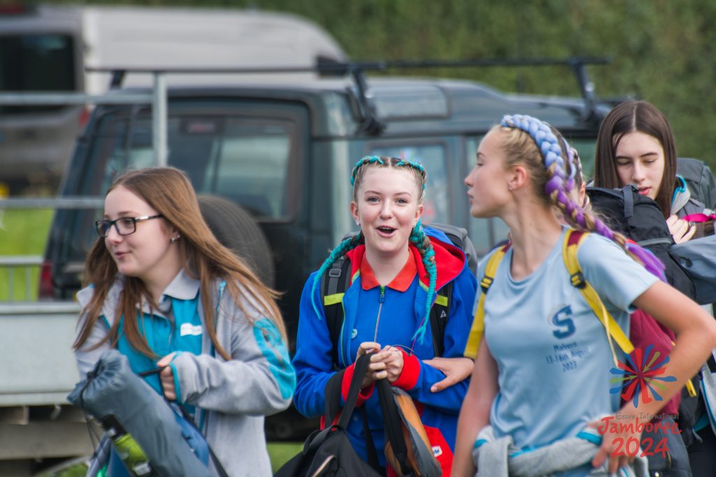 A group of Guides make their way on to the Jamboree site.