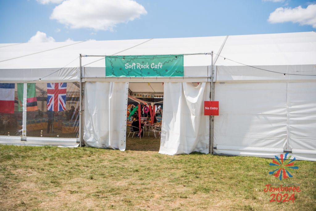 The side of a tent with a "Soft Rock Café" sign above the doorway, and a NO ENTRY sign