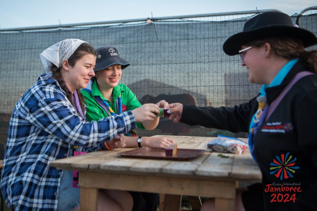 Three young people sharing mock shots