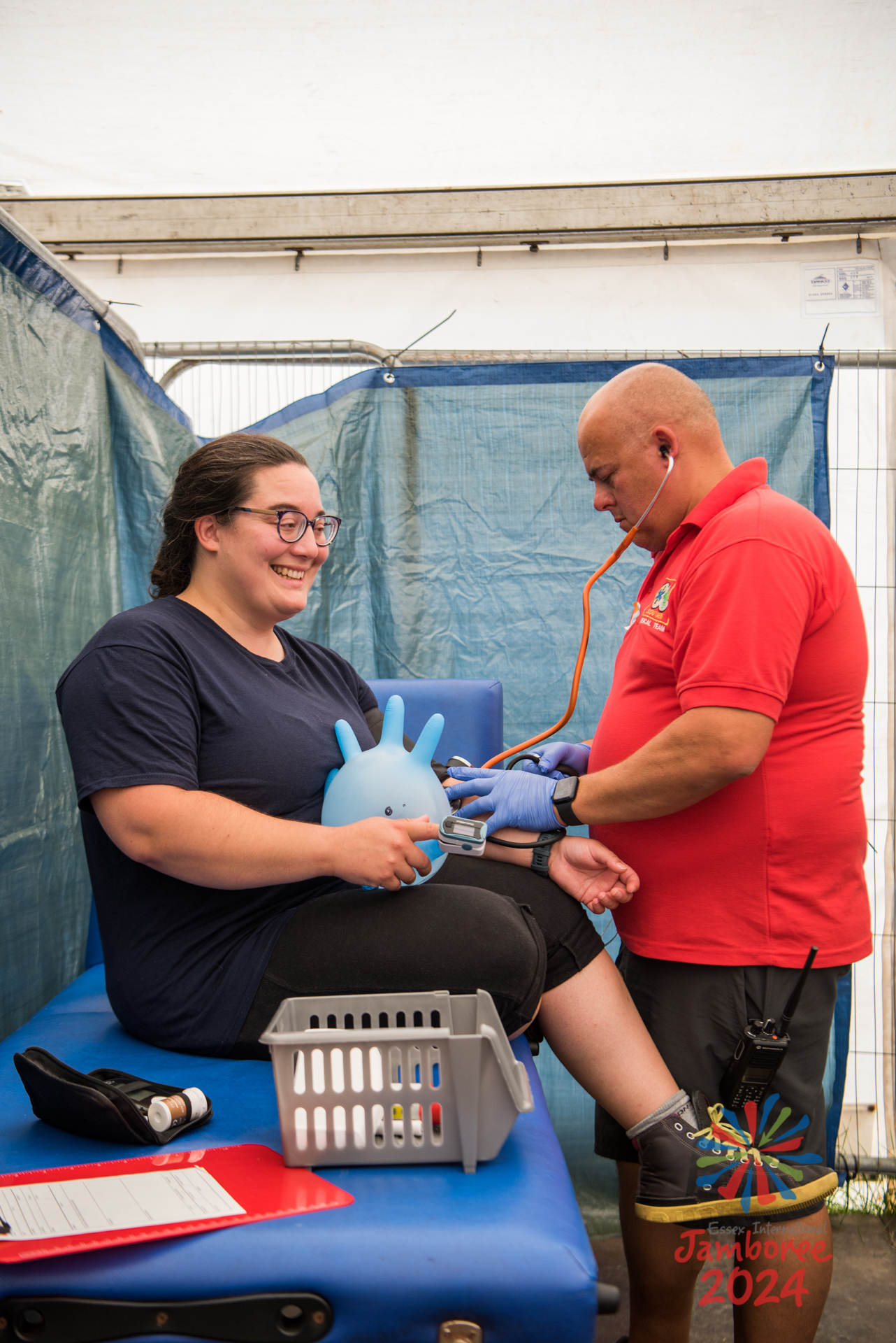 A woman being treated by a member of ScoutMed