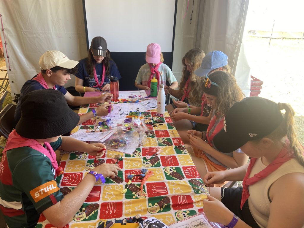 A group of participants sitting around a table enjoying arts and crafts.