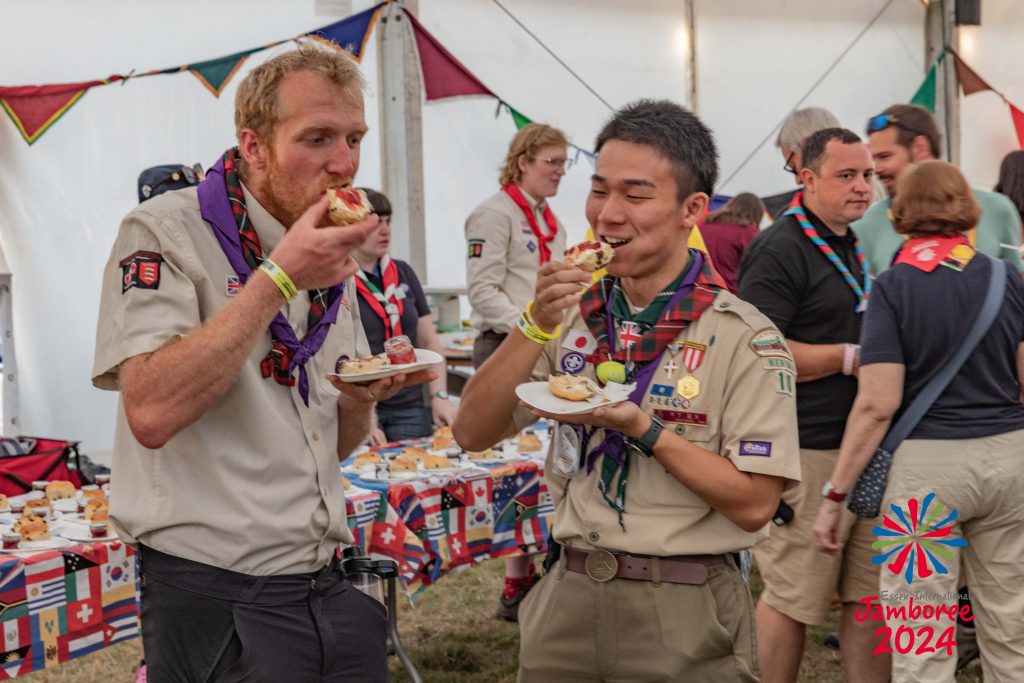 Two Adults eating scones