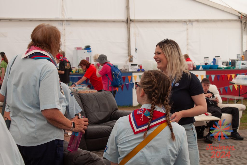 Mhairi laughs with some participants and staff