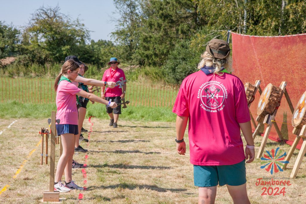 Members of the EIJ Tomahawk Team supervise as participants try Tomahawk throwing