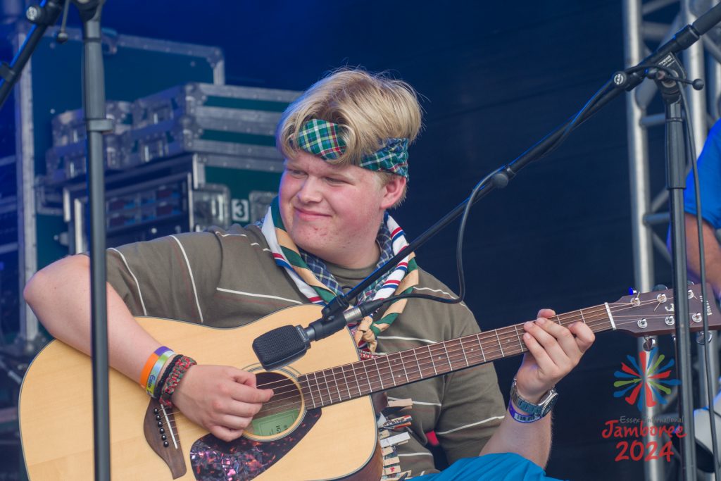 A participant playing guitar.