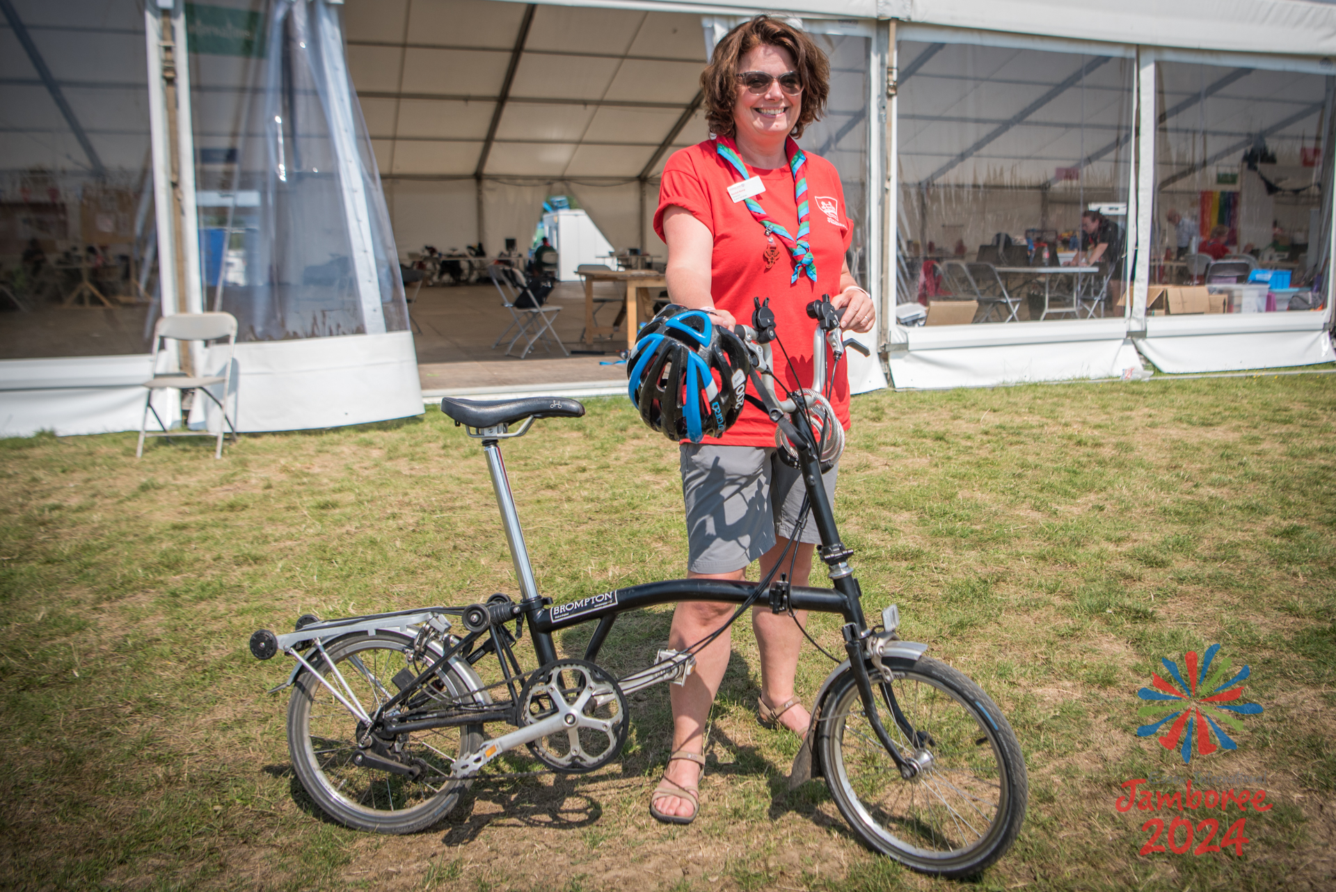 An EIJ director stands holding her bike