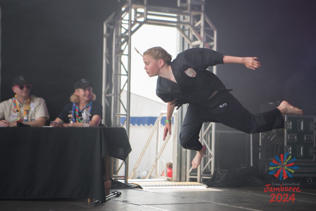 A girl caught in mid air, during her performance. 