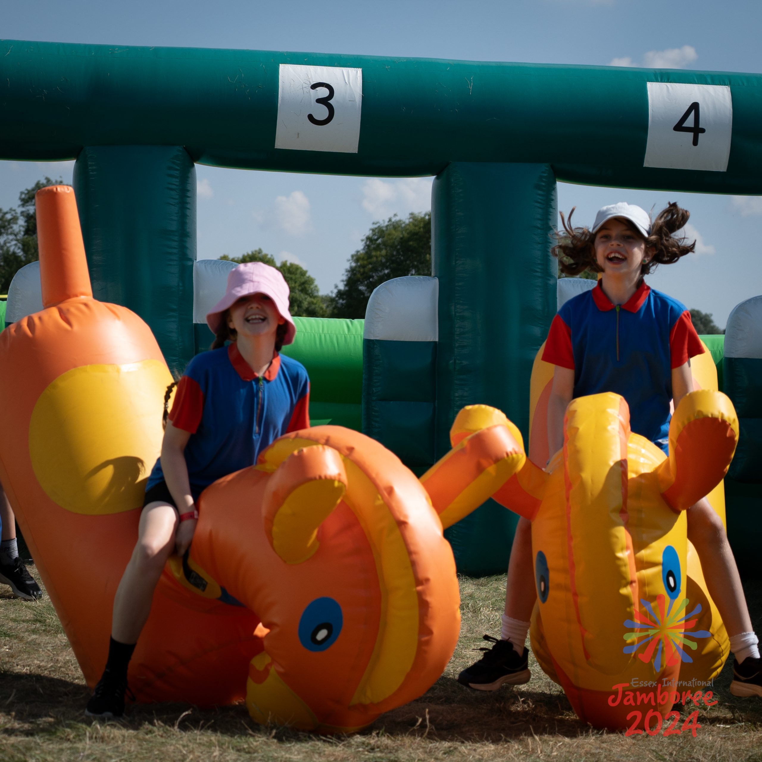 Two young people on inflatables.