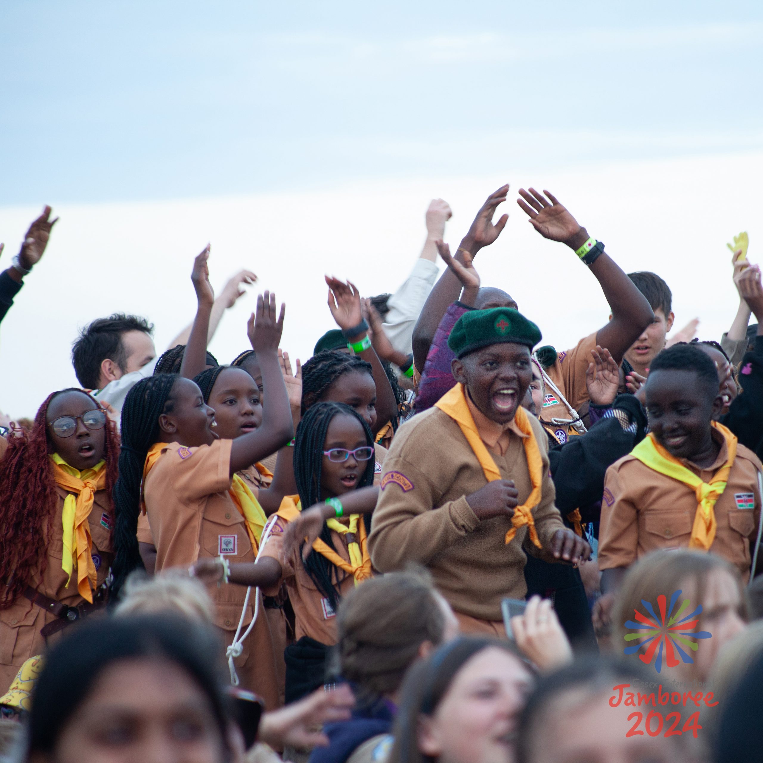 Young people cheering and dancing.