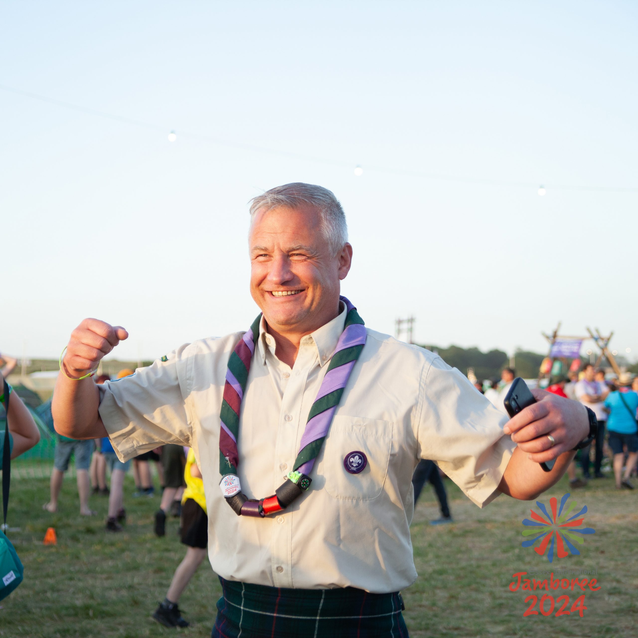 A Scout leader dancing.