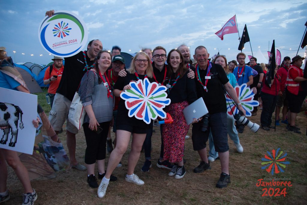 Members of the media team posing with noa, during the closing ceremony.