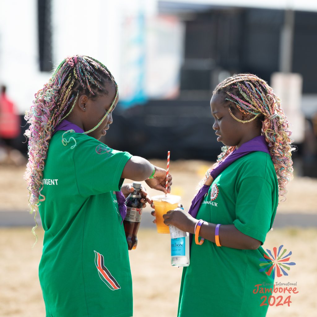 Two young people enjoying some cold drinks