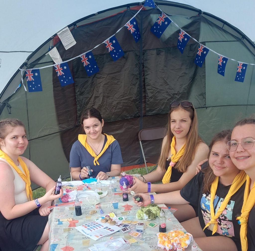 Members of Murray Subcamp sitting at a table taking part in tie-dyeing