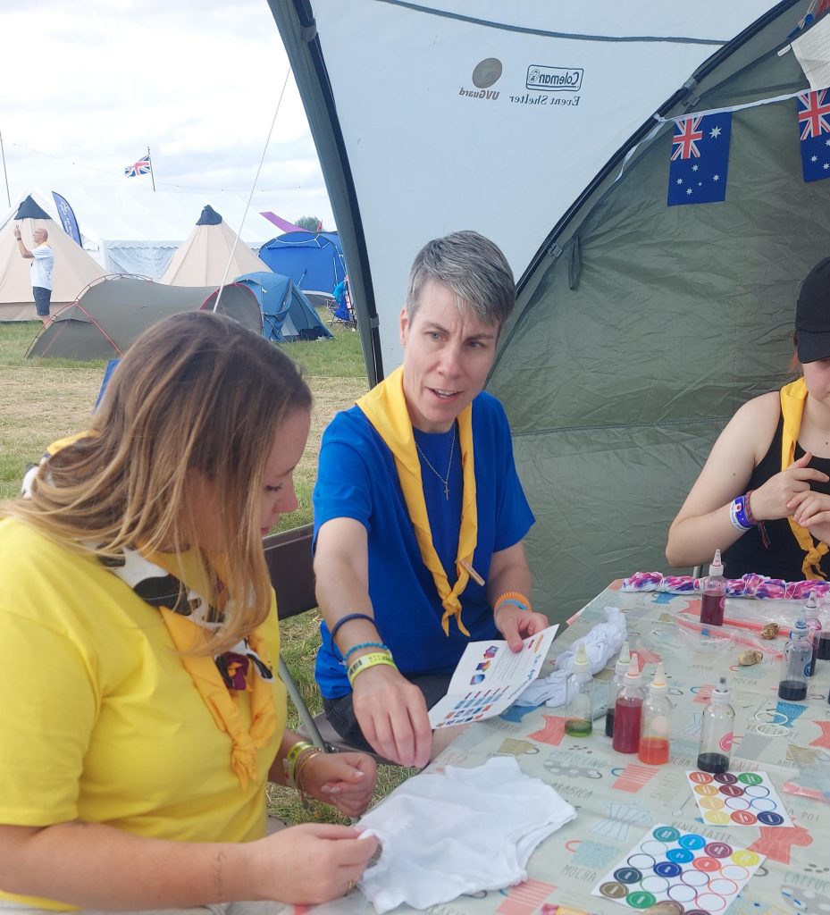 Members of Murray Subcamp sitting at a table taking part in tie-dyeing