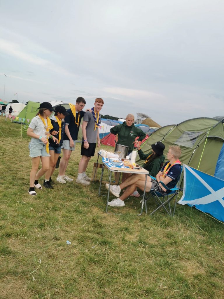 People queueing outside the Scottish contingent camp